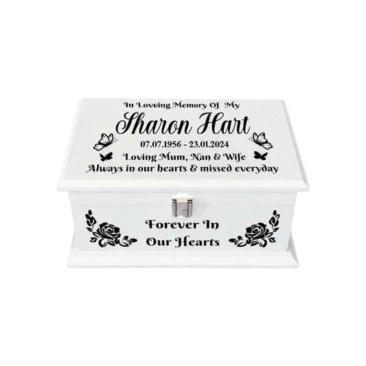 Memorial chest with personalised text and floral designs on a white background