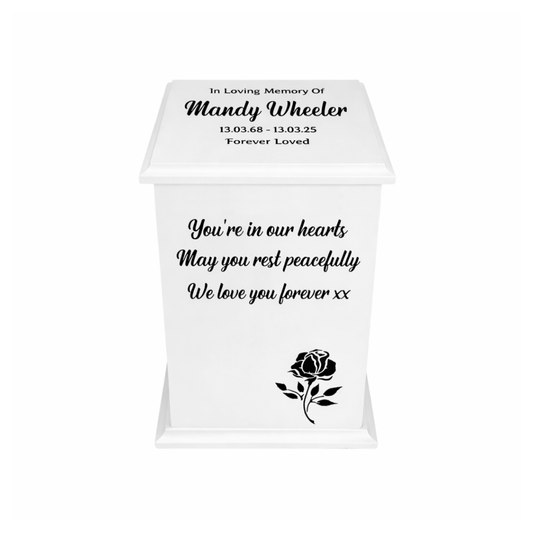 Memorial urn with personalized text and a rose design on a white background