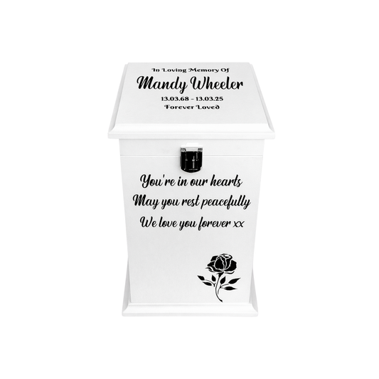White urn with black text and rose design on a white background